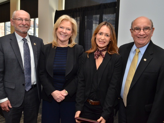 Pilar Prostko from CU Dialogues receiving the 2017 staff award from Provost Russ Moore, Vice Provost for Outreach and Engagement Sara Thompson and Chancellor Phil DiStefano.