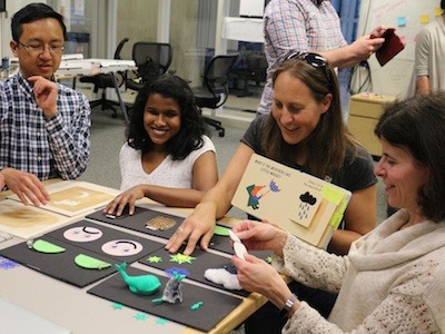 Faculty and staff from the Build a Better Book Project interact with a 3D version of children's book designed for those with impaired vision. This project is partially funded through a CU Boulder Outreach Award. (Photo by Sue Postema Scheeres, CU Boulder)