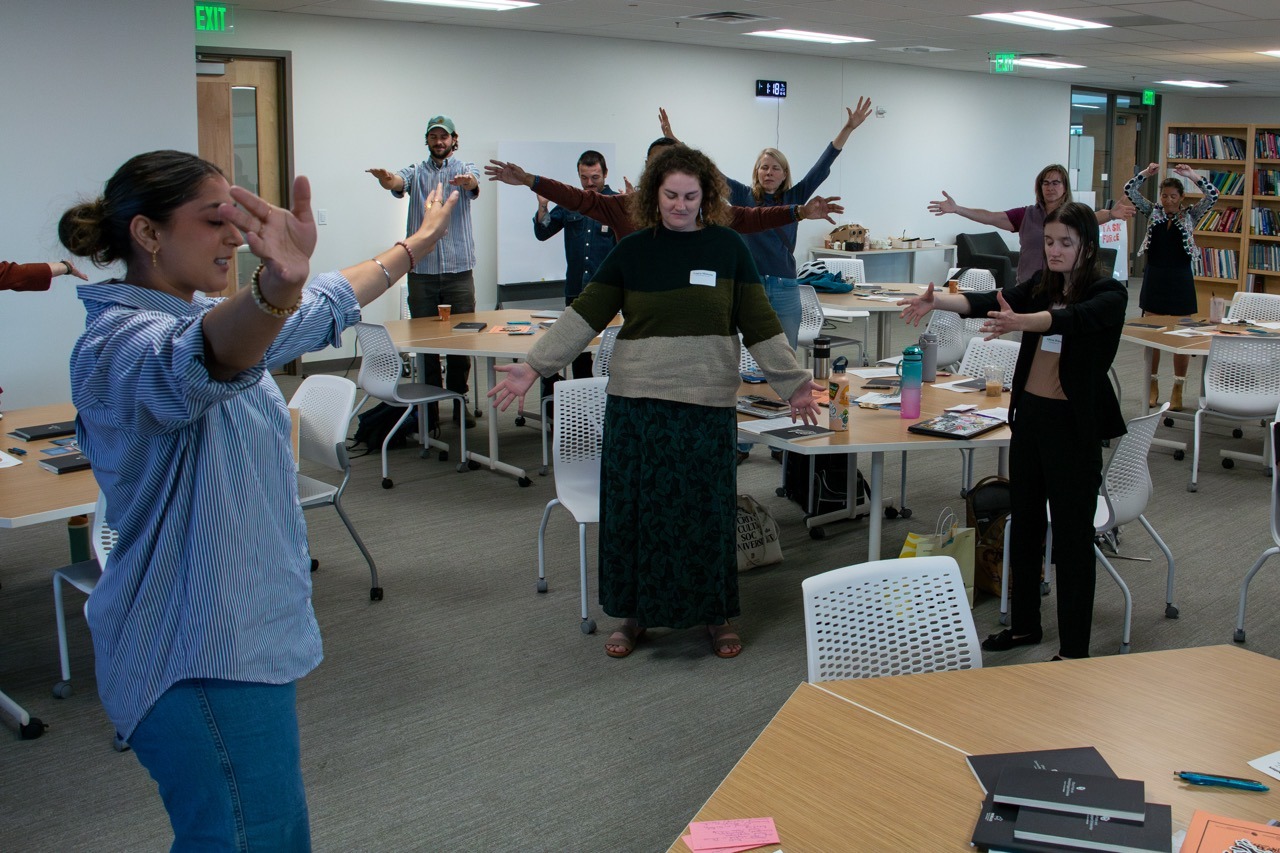 Harveen Gill leads a group meditation during a presentation on her work as an Engaged Arts and Humanities Scholar at Research and Innovation Week.